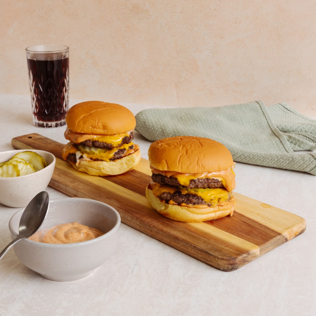 Close-up of a juicy double cheeseburger, part of an easy 10-minute recipe from Lamanna.