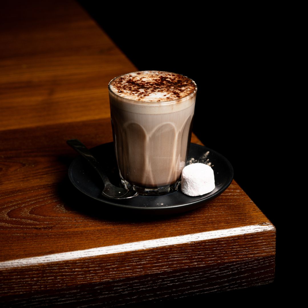 lamanna hot chocolate with marsh mellow sittong on a table