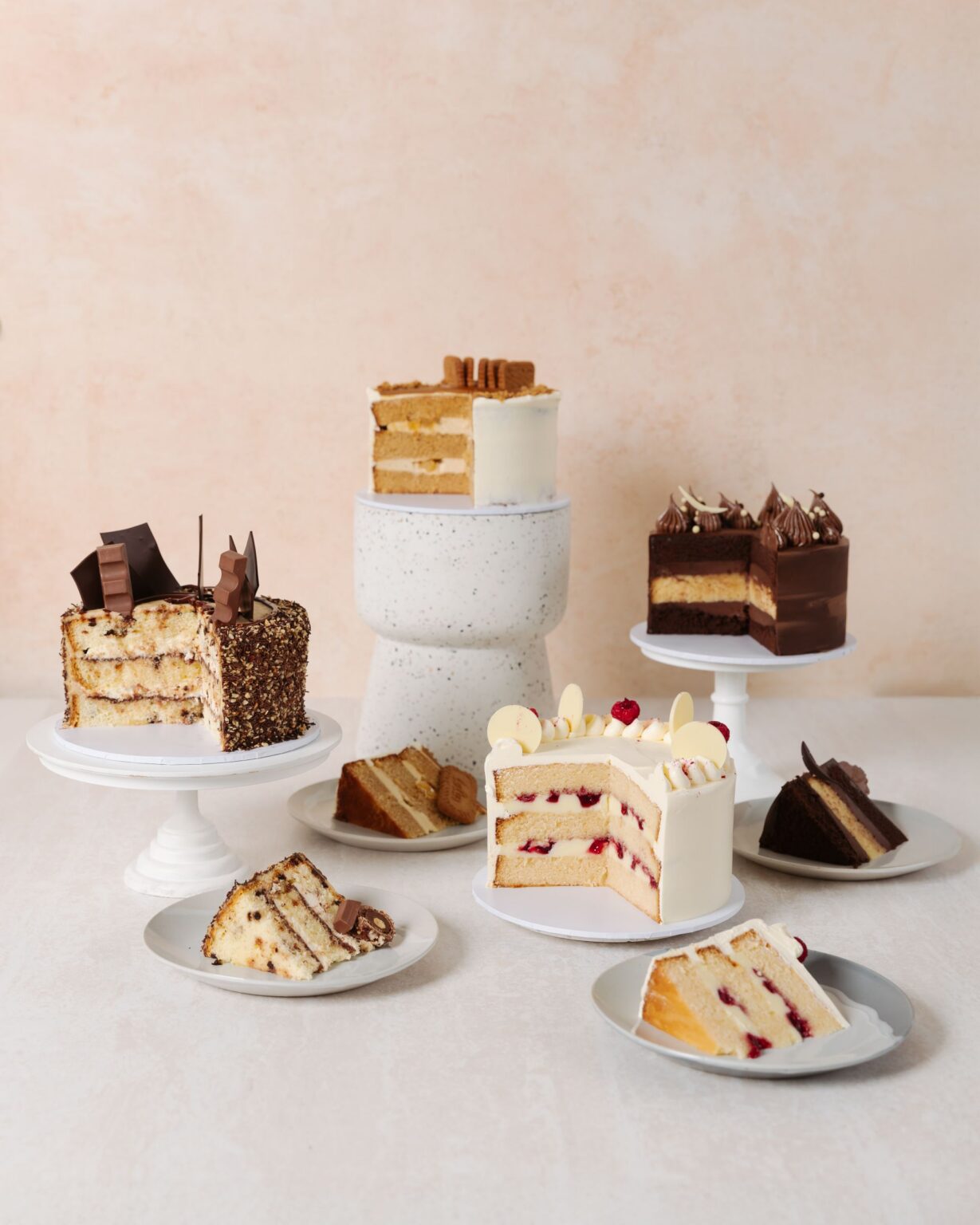 lamanna patisserie daily cakes range on cake stands and plates