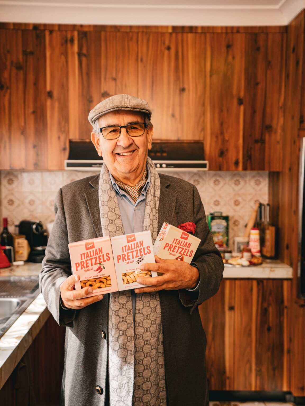 Nonno holding bippi italian pretzels in nonnas kitchen