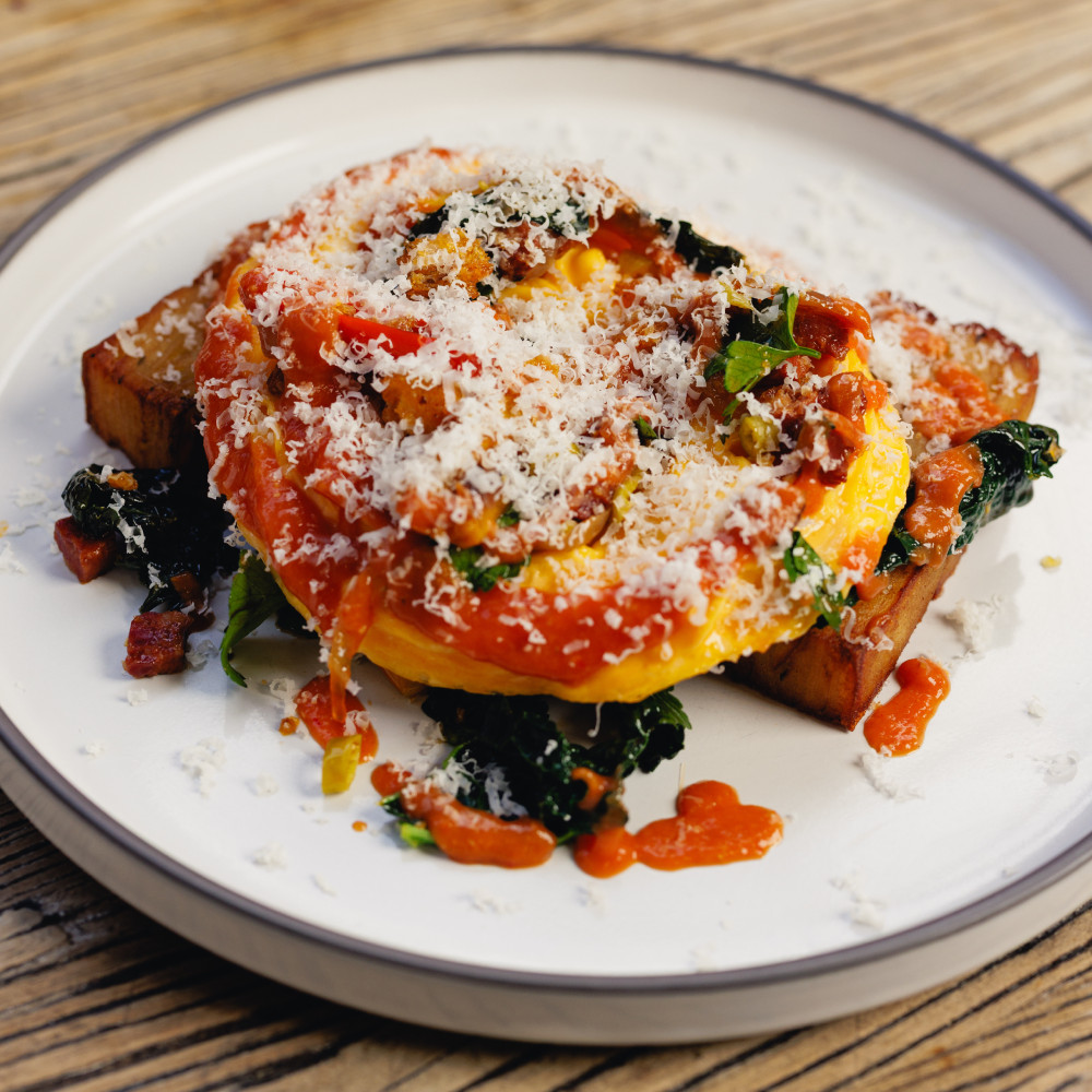Chilli scramble breakfast with fresh herbs served at LaManna Café Essendon Fields