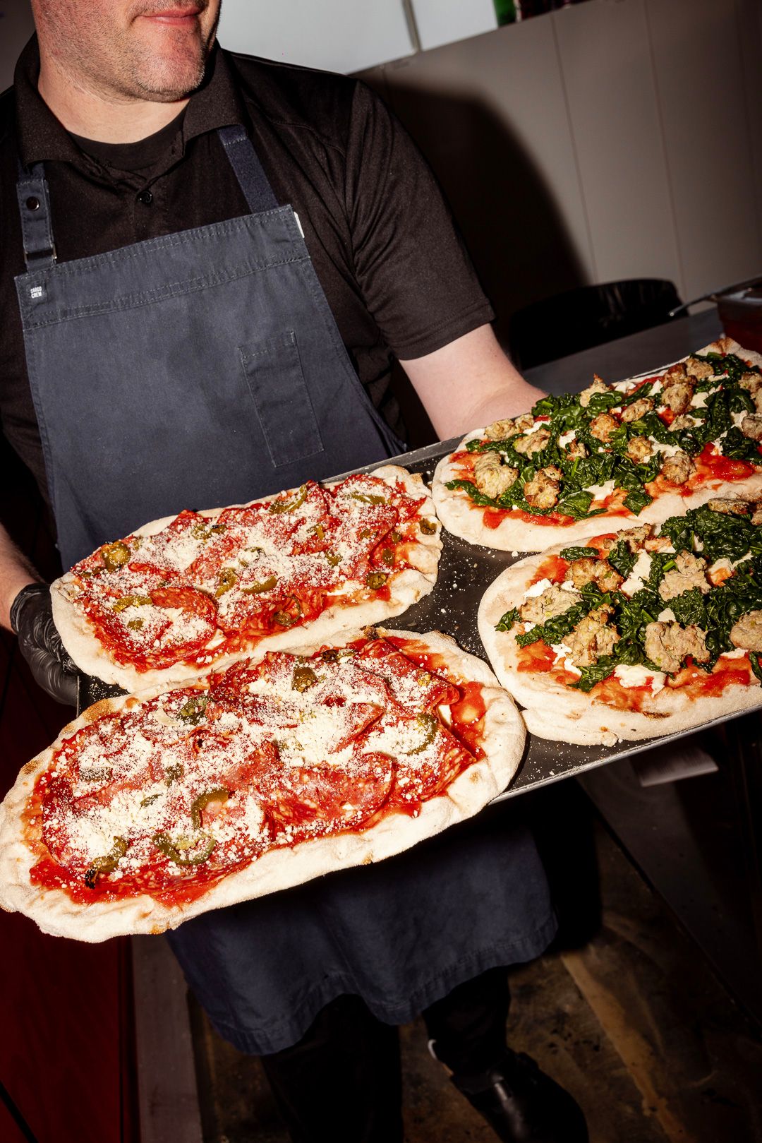 lamanna pizza pinsas on a tray