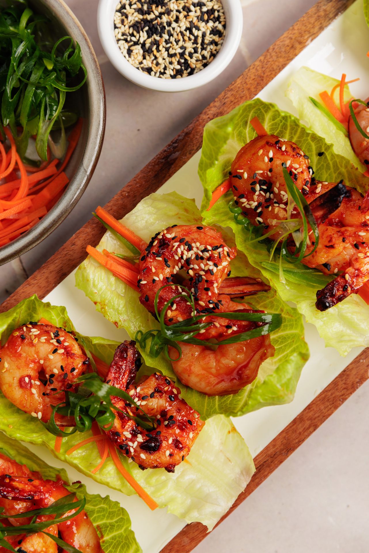 sweet chilli prawn lettuce cups on serving board